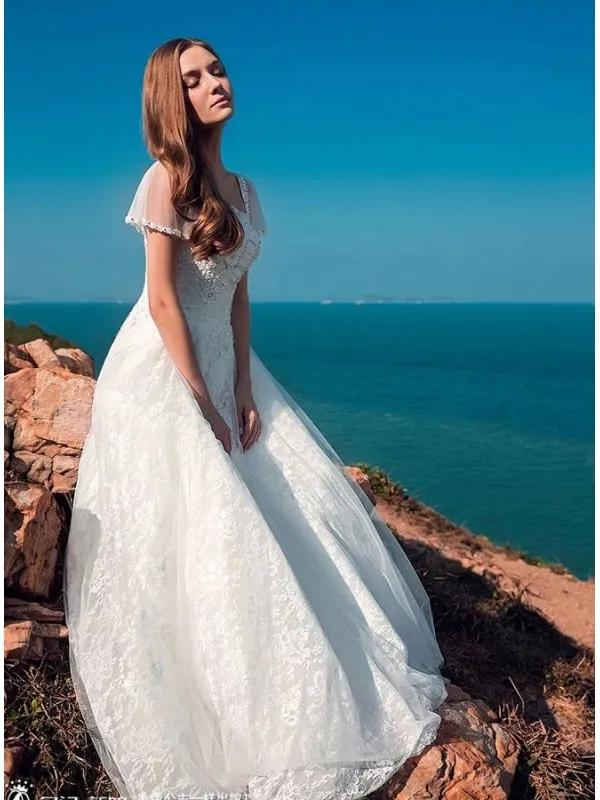 Abito da Sposa in pizzo con maniche corte e gonna elegante in pizzo macrame